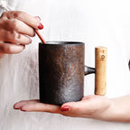 Handmade coarse pottery mug with spoon