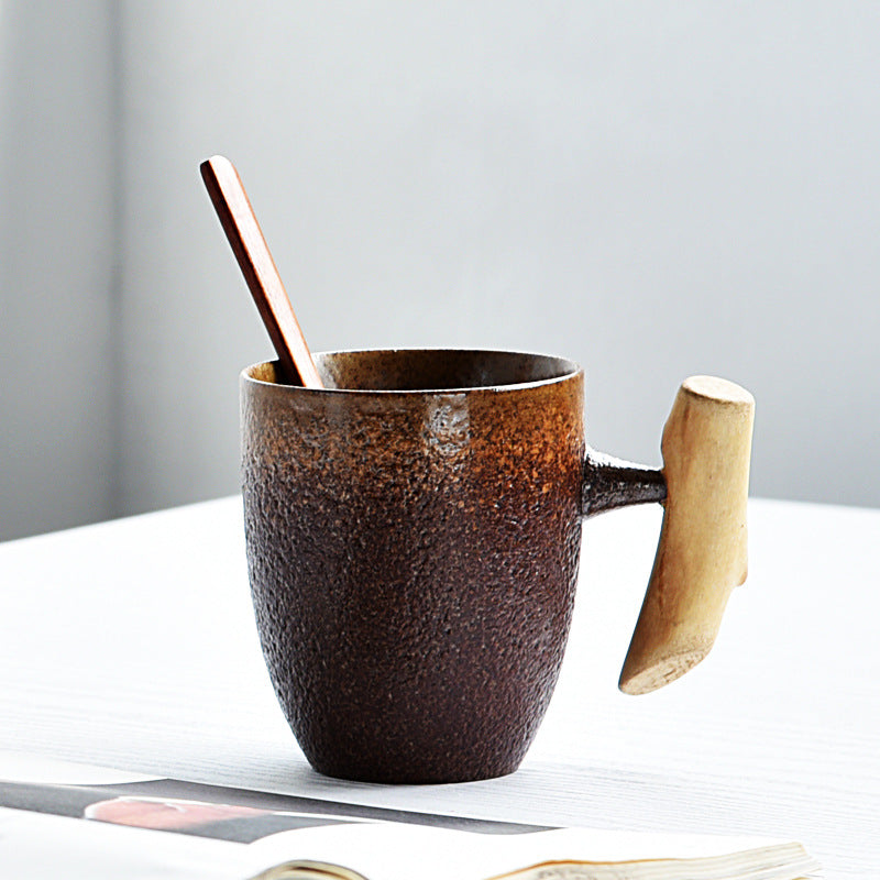 Handmade coarse pottery mug with spoon