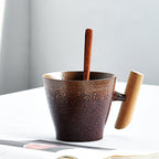 Handmade coarse pottery mug with spoon