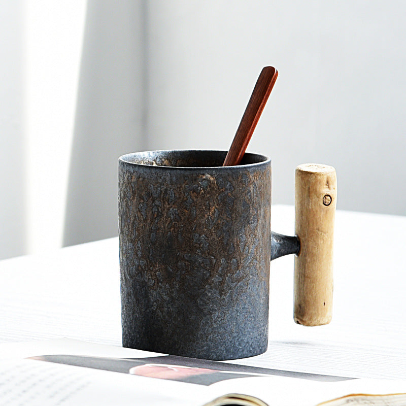 Handmade coarse pottery mug with spoon