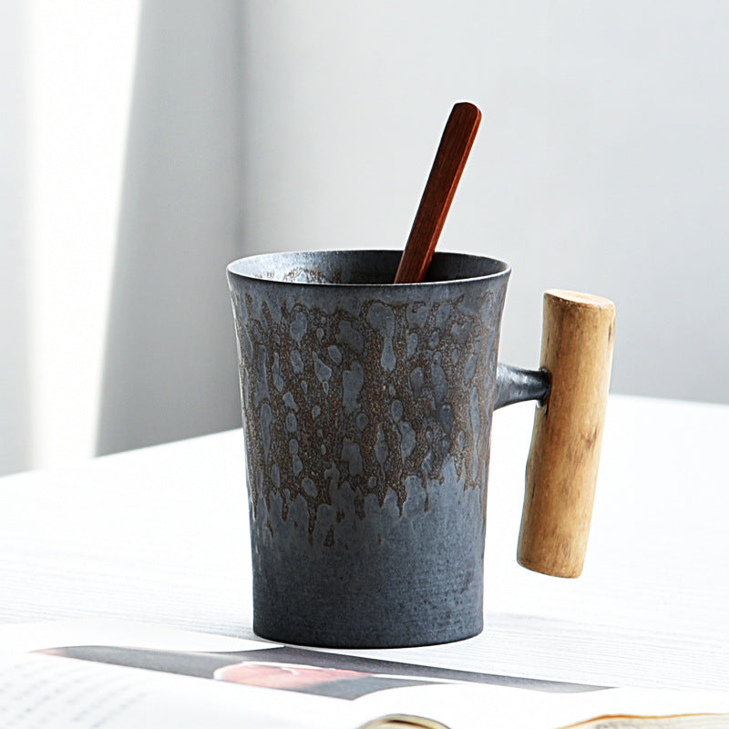 Handmade coarse pottery mug with spoon