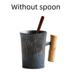 Handmade coarse pottery mug with spoon