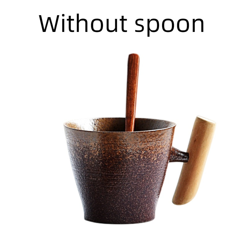 Handmade coarse pottery mug with spoon