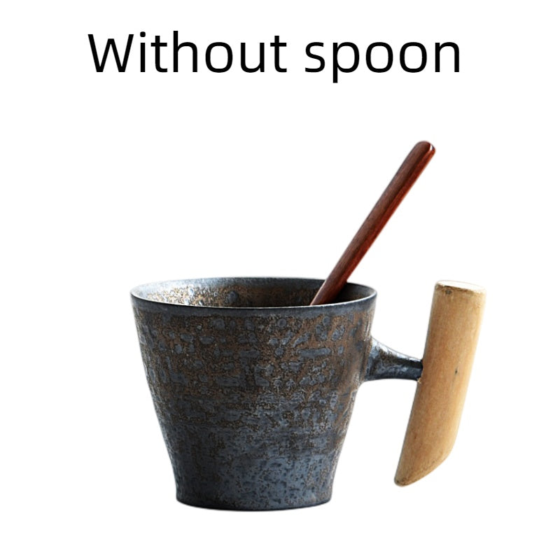 Handmade coarse pottery mug with spoon