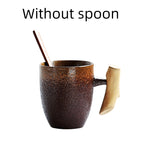 Handmade coarse pottery mug with spoon