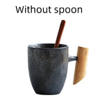 Handmade coarse pottery mug with spoon